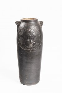 AN ART NOUVEAU VASE WITH A BABY