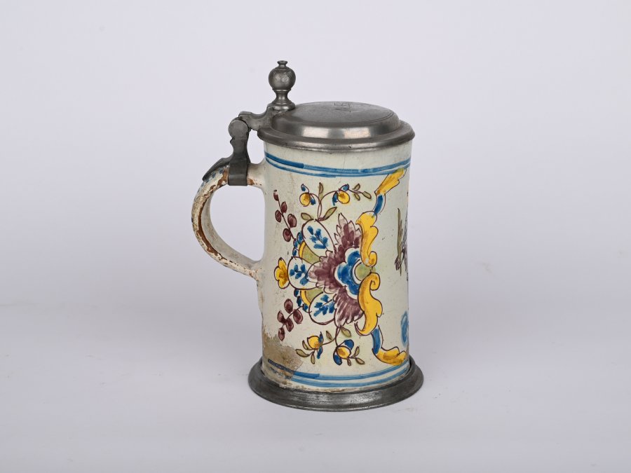 A JUG WITH A LID