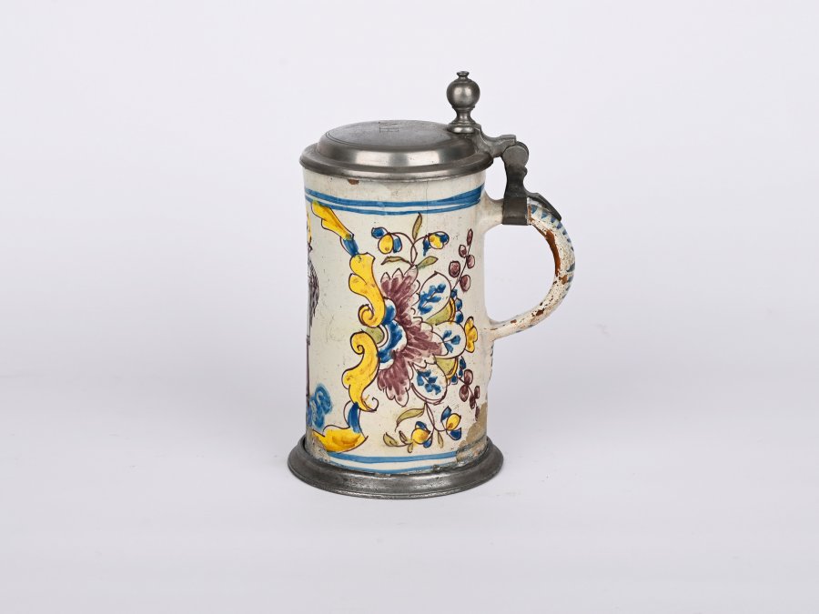 A JUG WITH A LID