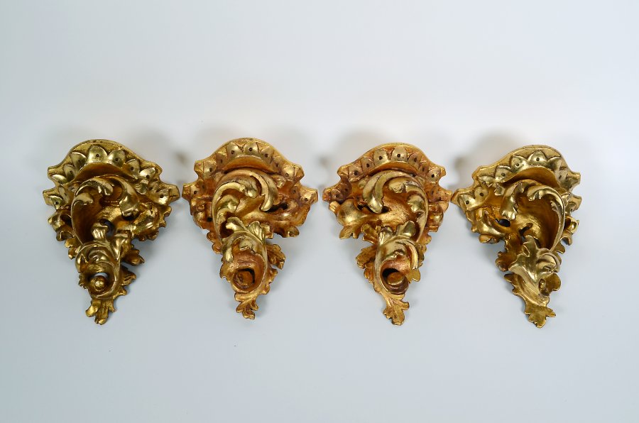 FOUR GILDED DECORATIONS