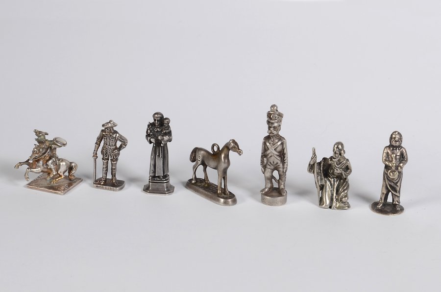 SET OF SILVER FIGURINES