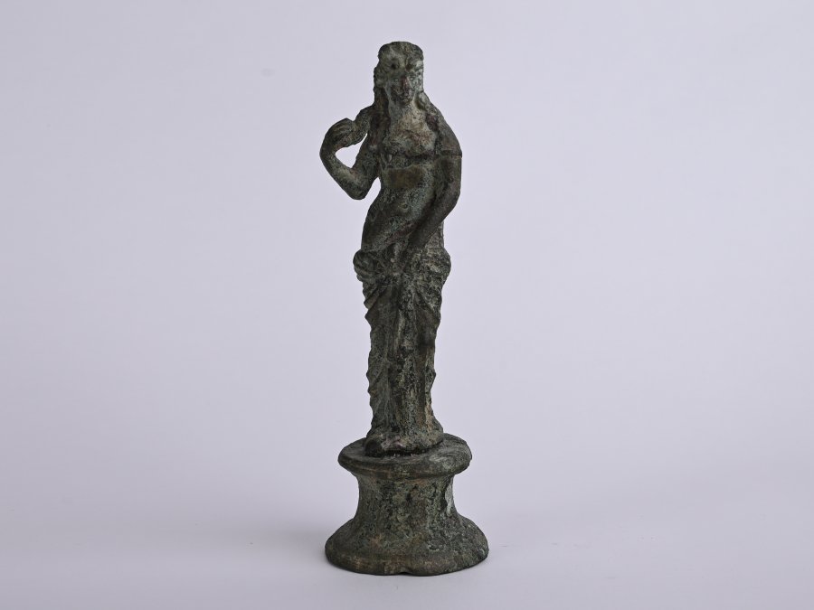 A STATUETTE OF A WOMAN