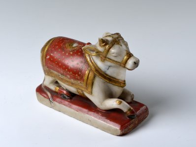 A LYING COW FIGURE