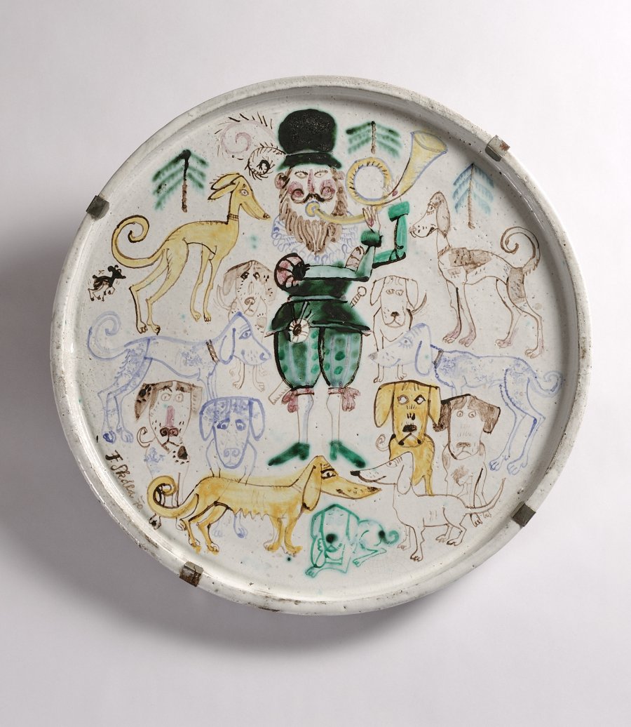 A CERAMIC PLATE WITH HUNTER AND DOG MOTIF 