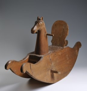 A SPRUCEWOOD ROCKING HORSE