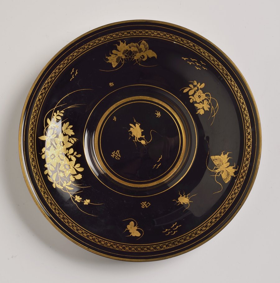 BLACK HYALITE GLASS - CUP AND SAUCER WITH CHINOISERIE MOTIFS