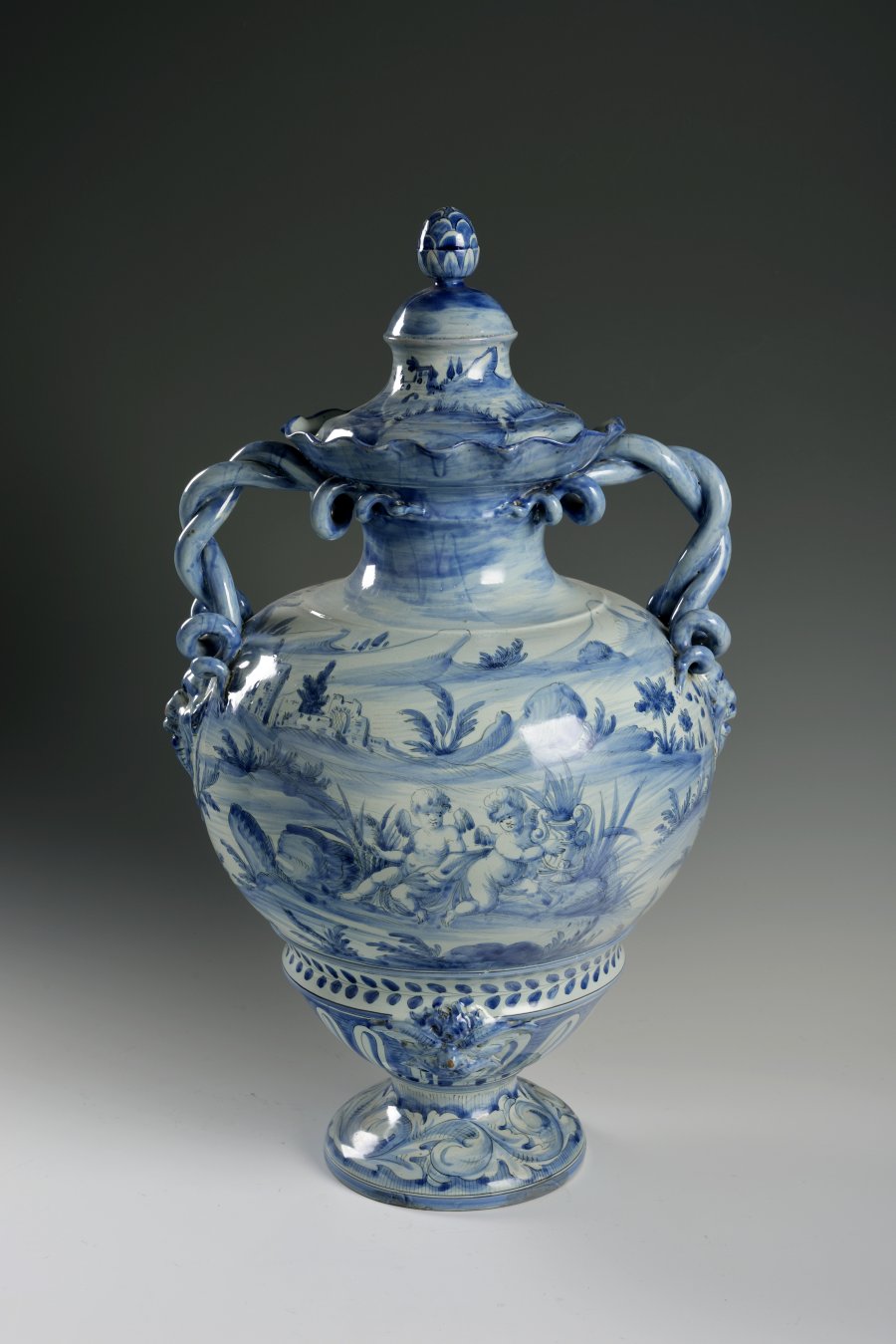 A VASE WITH A LID