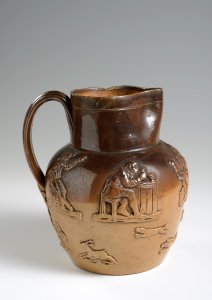 A SALT GLAZED PITCHER WITH HUNTING MOTIFS