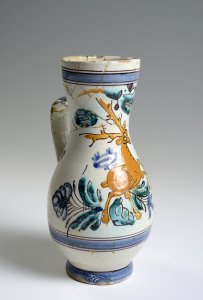 A PAIR OF TWO FOLK PITCHERS WITH A STAG AND FLOWER MOTIFS.