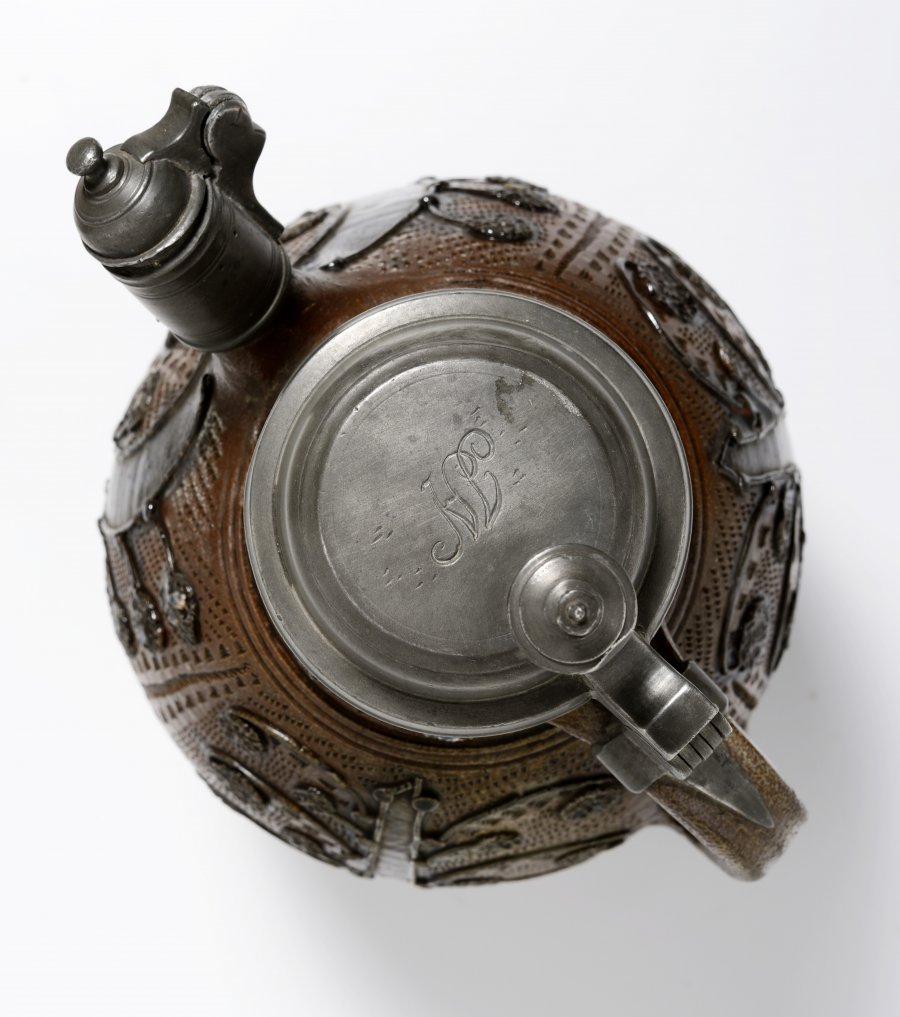 A STONEWARE KETTLE WITH PEWTER MOUNTS