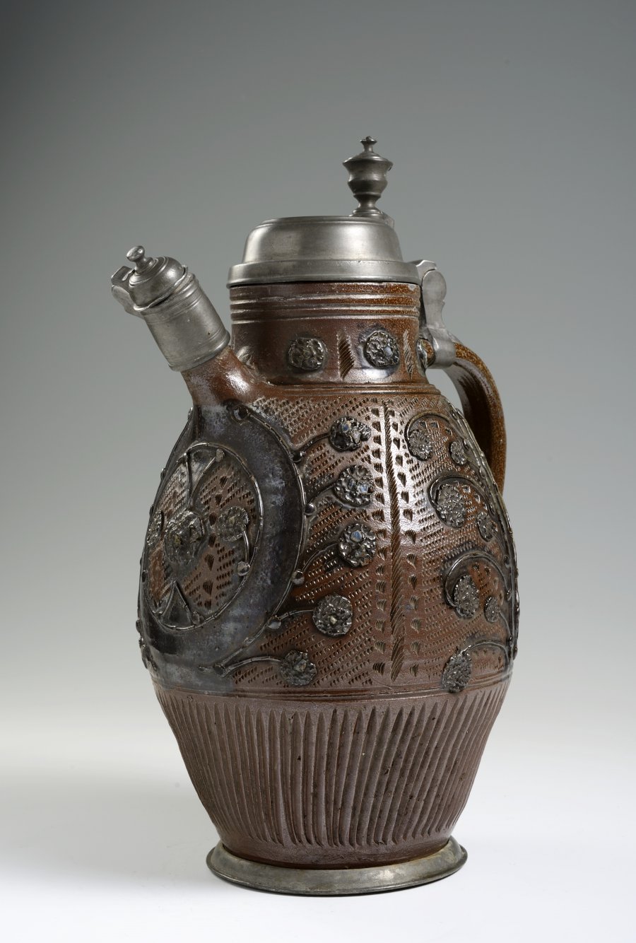 A STONEWARE KETTLE WITH PEWTER MOUNTS