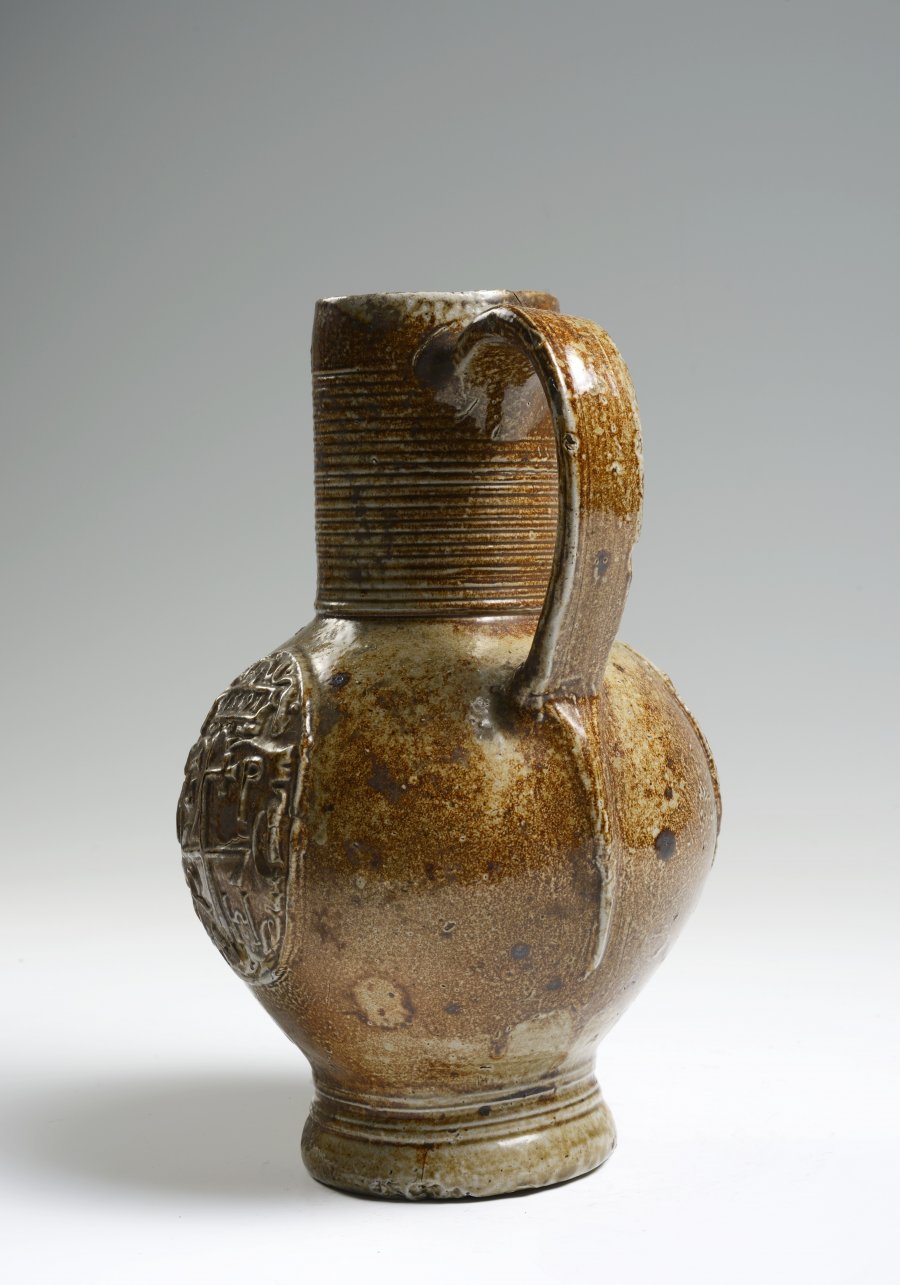 A SALT GLAZED PITCHER WITH RELIEFS