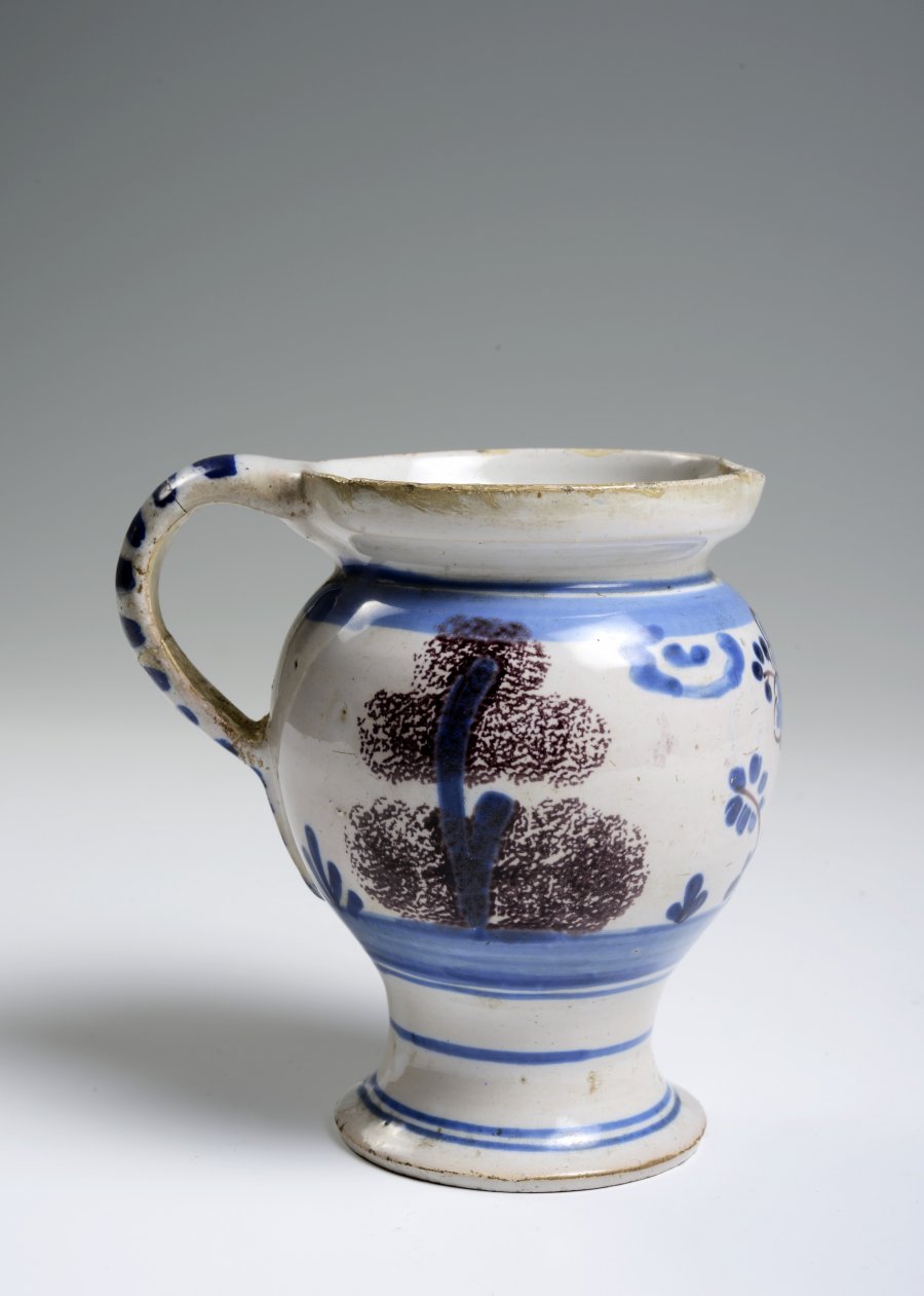 A SMALL FAÏENCE PITCHER