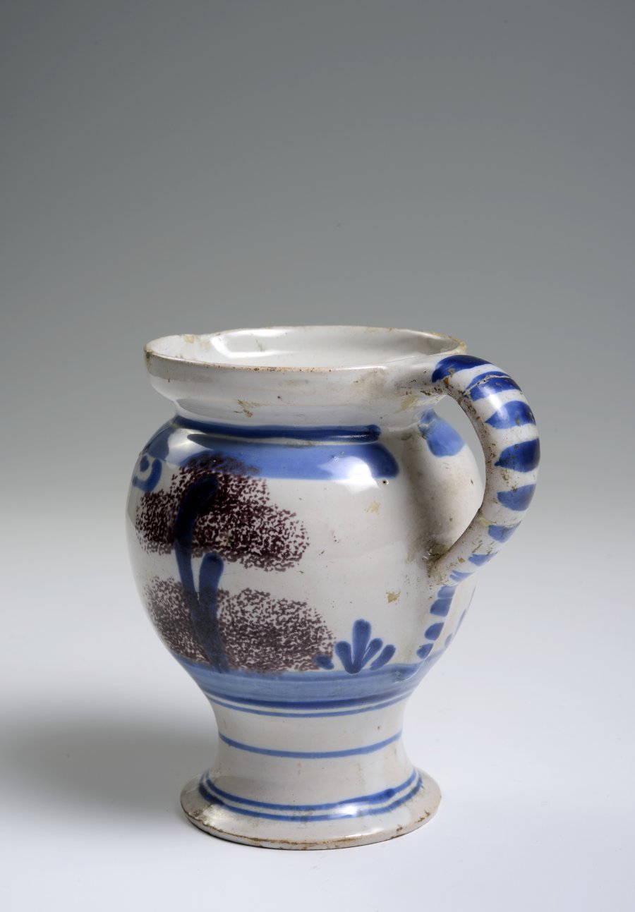 A SMALL FAÏENCE PITCHER