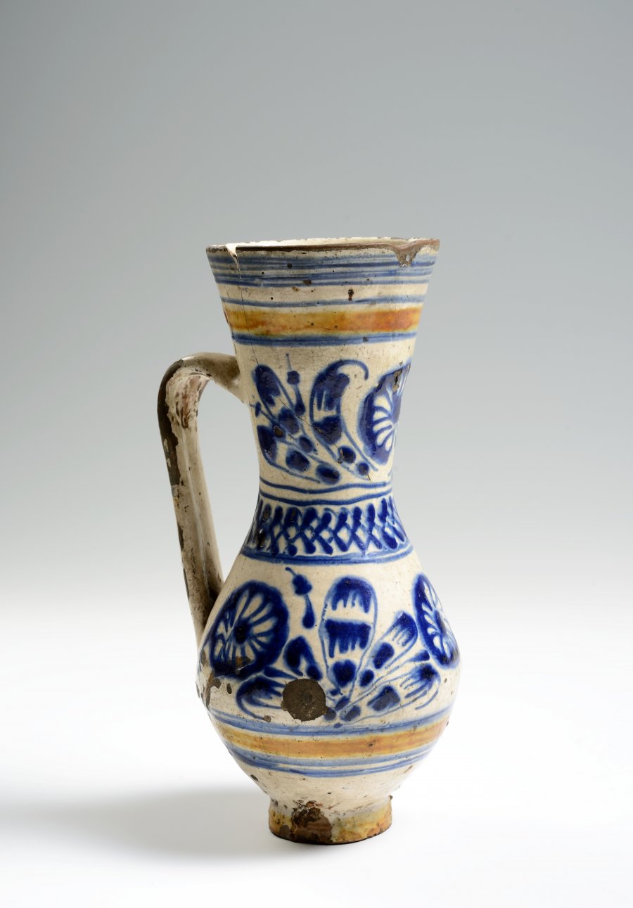 A PAIR OF TWO FOLK PITCHERS WITH A STAG AND FLOWER MOTIFS.