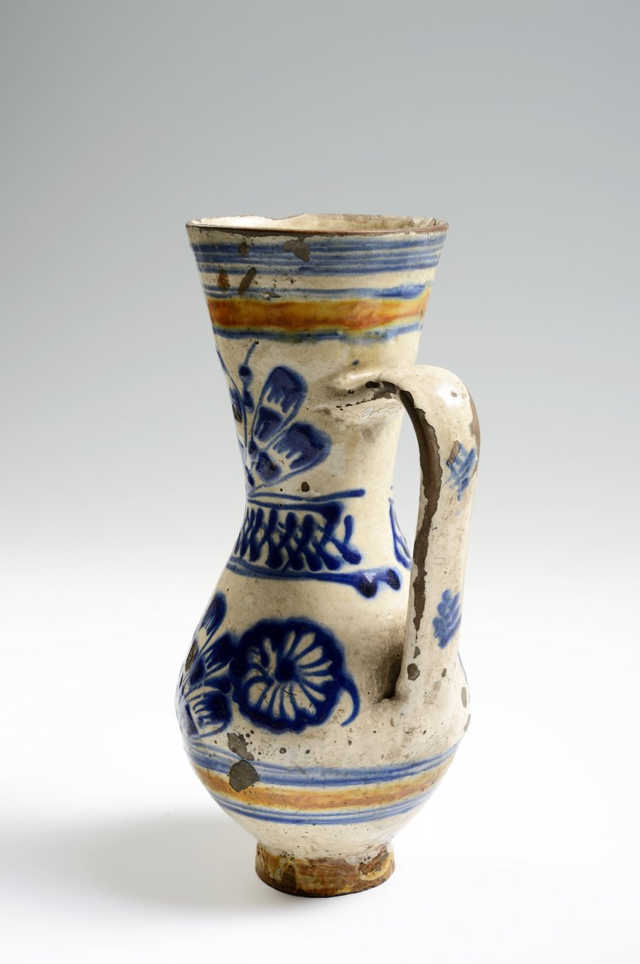 A PAIR OF TWO FOLK PITCHERS WITH A STAG AND FLOWER MOTIFS.