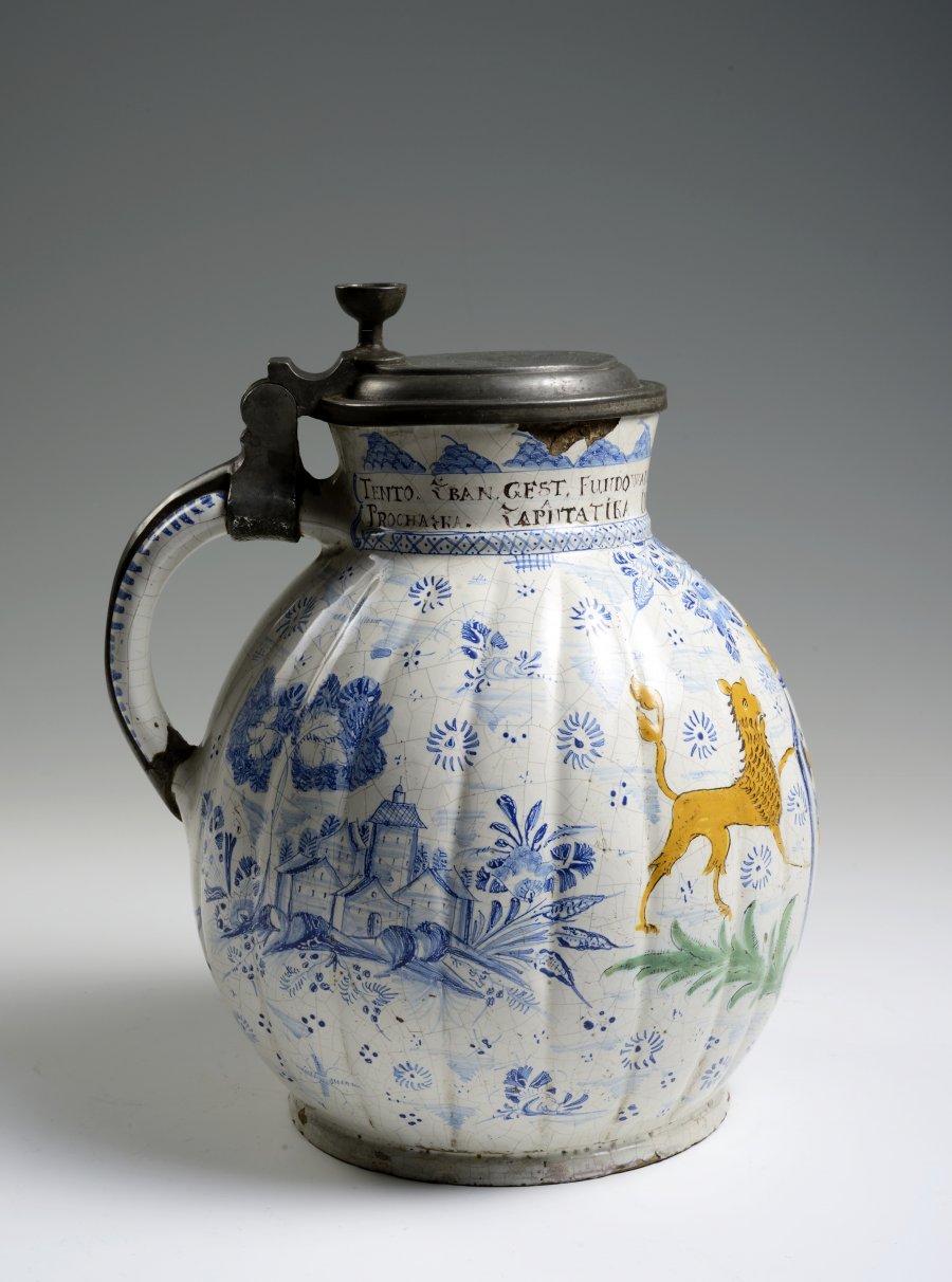 A FAÏENCE PITCHER WITH A PEWTER LID AND THE MARK OF THE CABINETMAKERS' GUILD