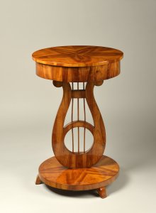 A SEWING TABLE WITH A LYRE