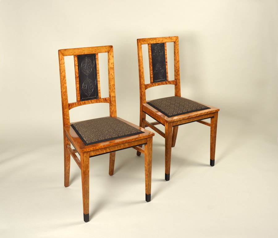 A BOOKCASE AND TWO CHAIRS