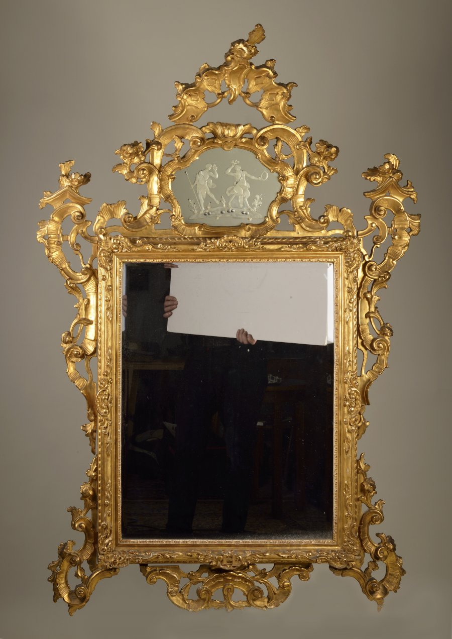 A LARGE BAROQUE MIRROR