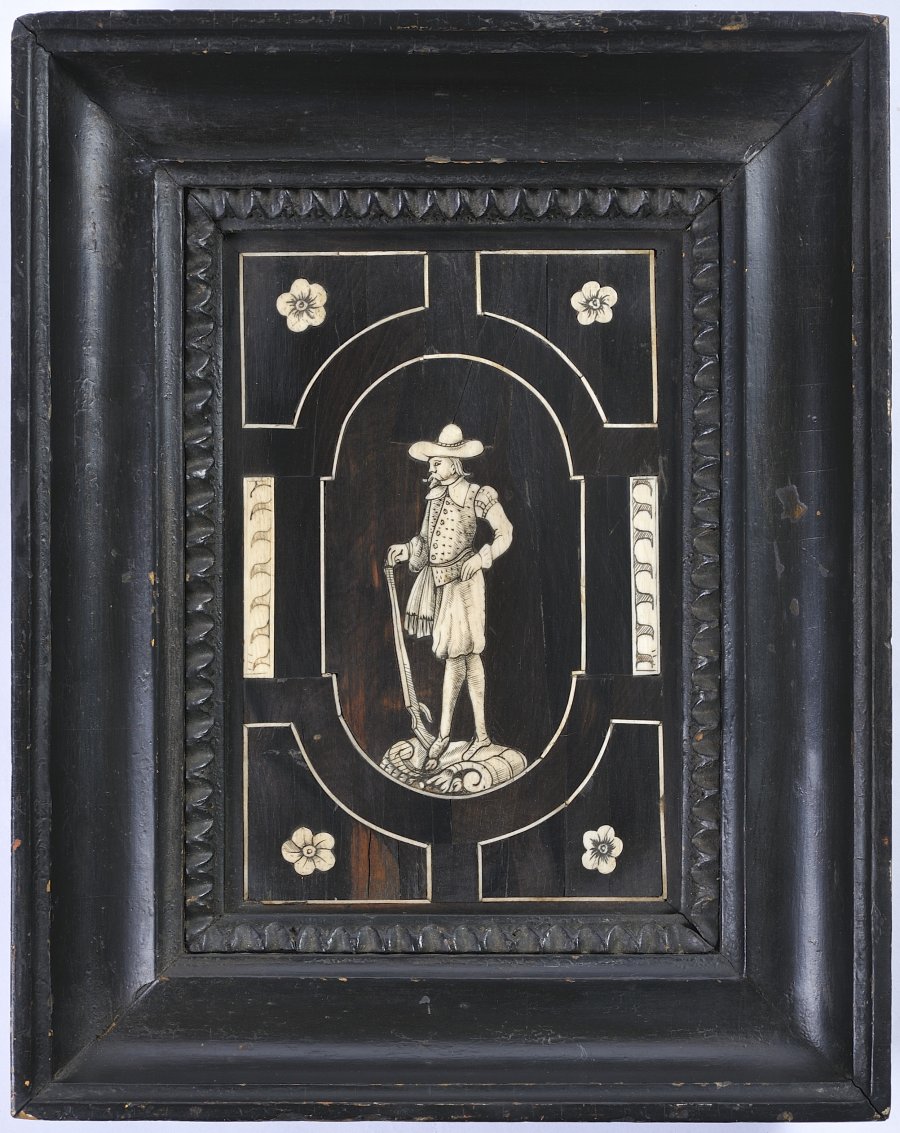 A FURNITURE PANEL WITH A SOLDIER FIGURE