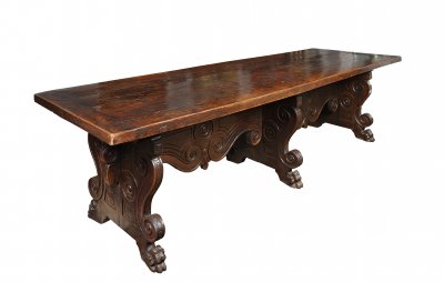 A WALNUT DINING TABLE