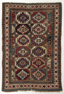 AN ANTIQUE MOGHAN KAZAK RUG