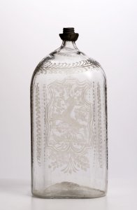 A CLEAR ENGRAVED GLASS FLASK 