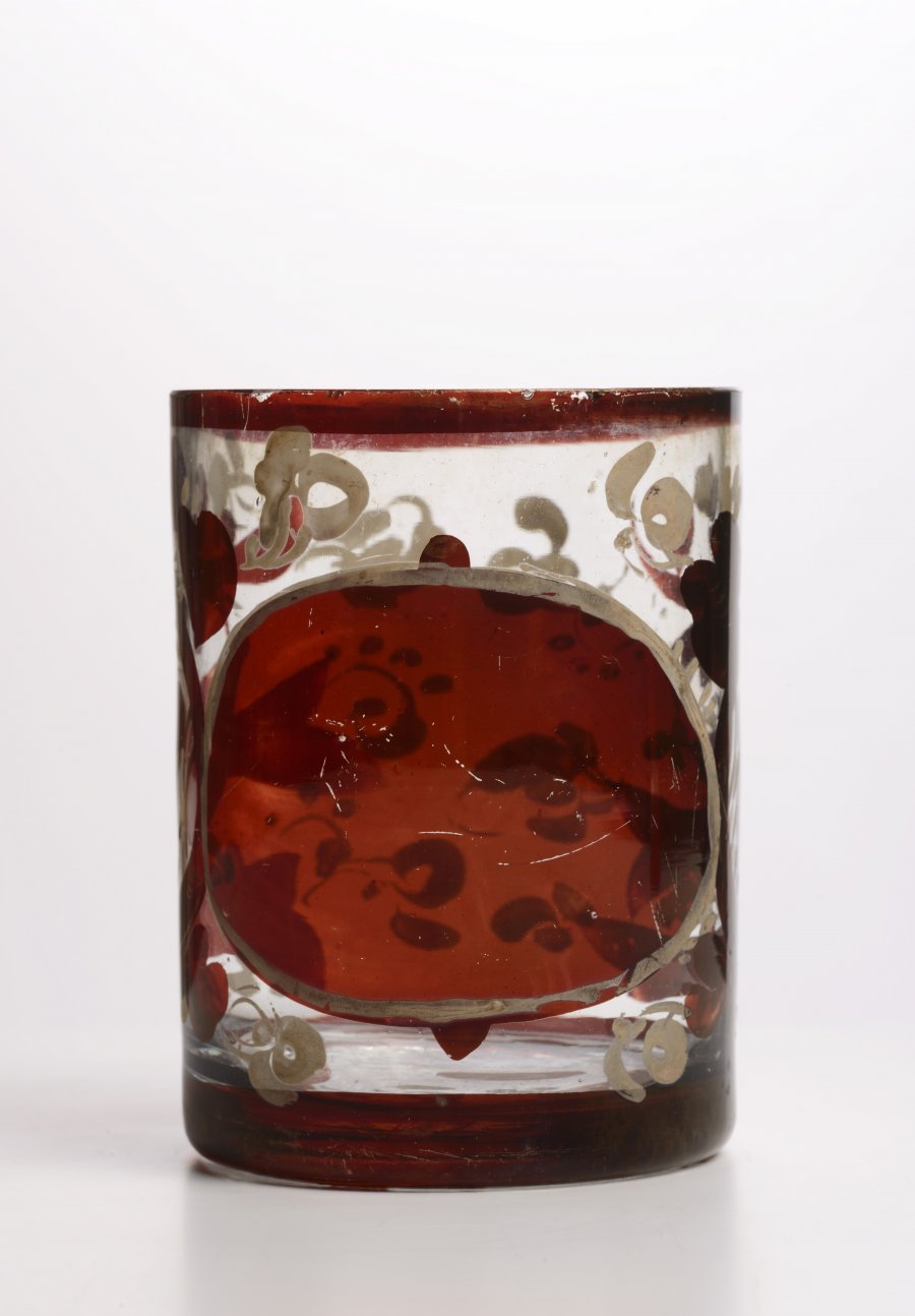 A GROUP OF THREE GLASSES DECORATED WITH RED GLAZE