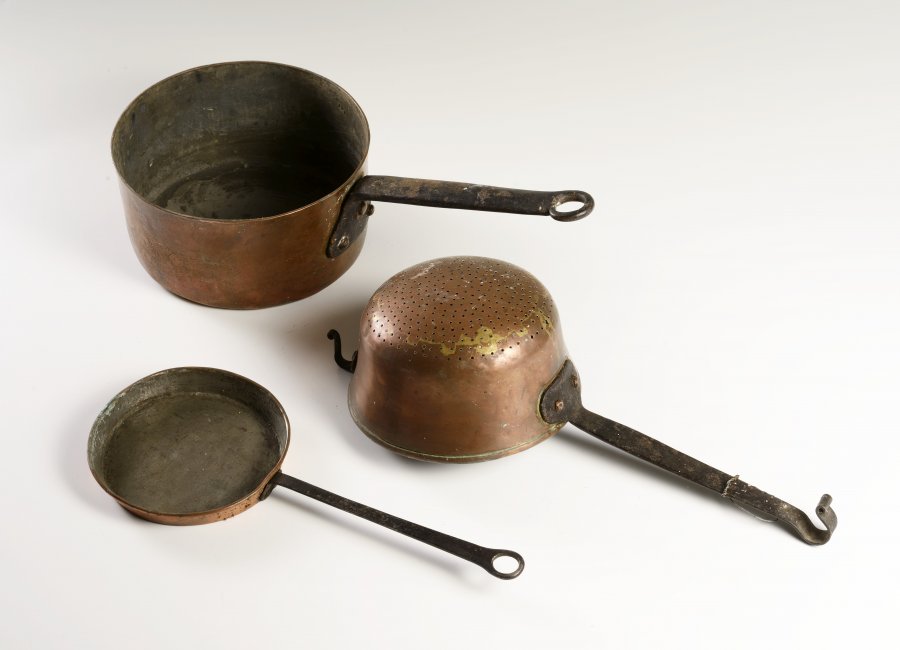 A GROUP OF THREE COPPER AND IRON PANS