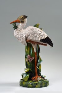 A CERAMIC VASE WITH A STORK