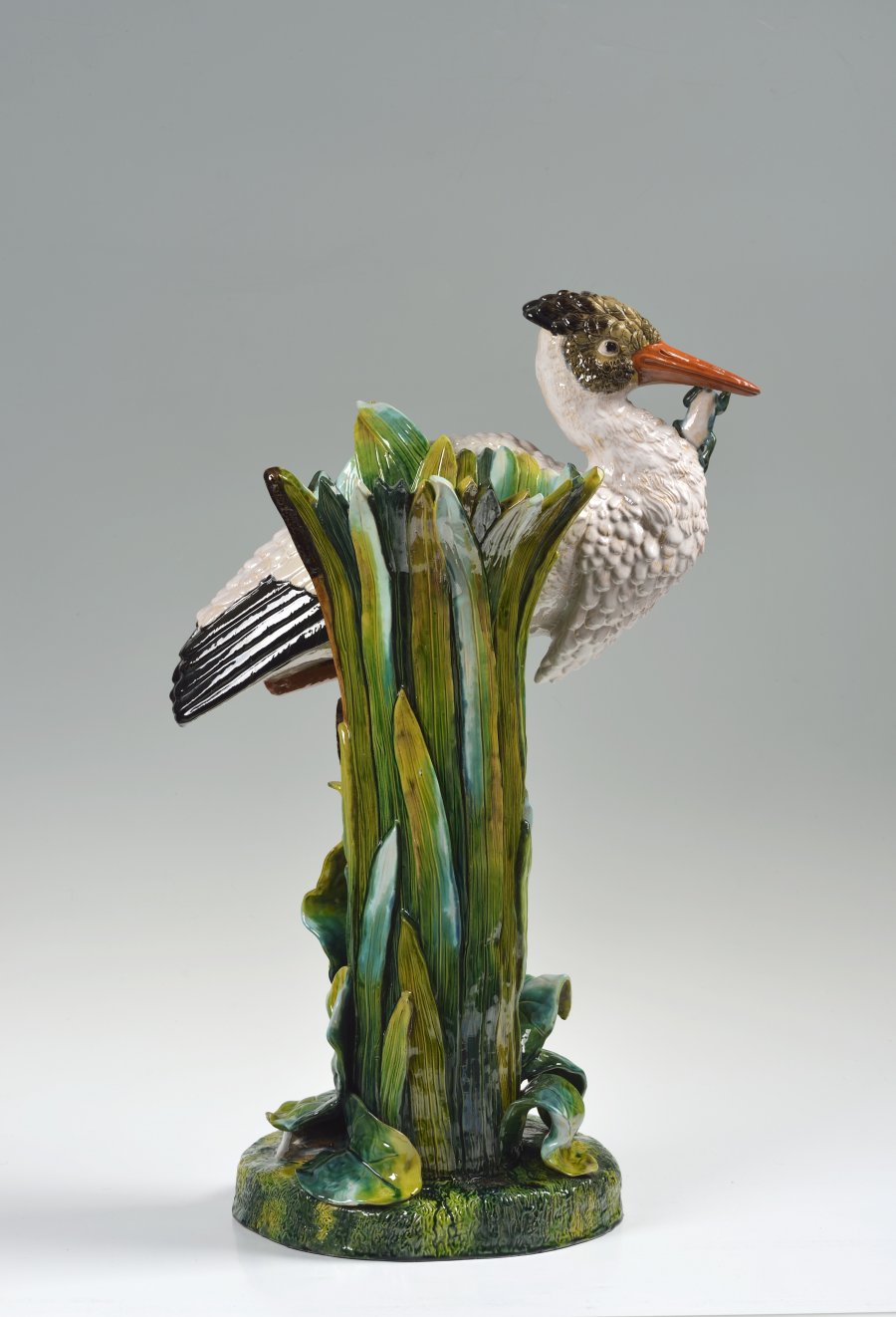 A CERAMIC VASE WITH A STORK