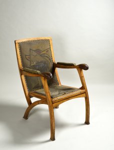 AN ARMCHAIR WITH A PAINTING BY OTA JANEČEK