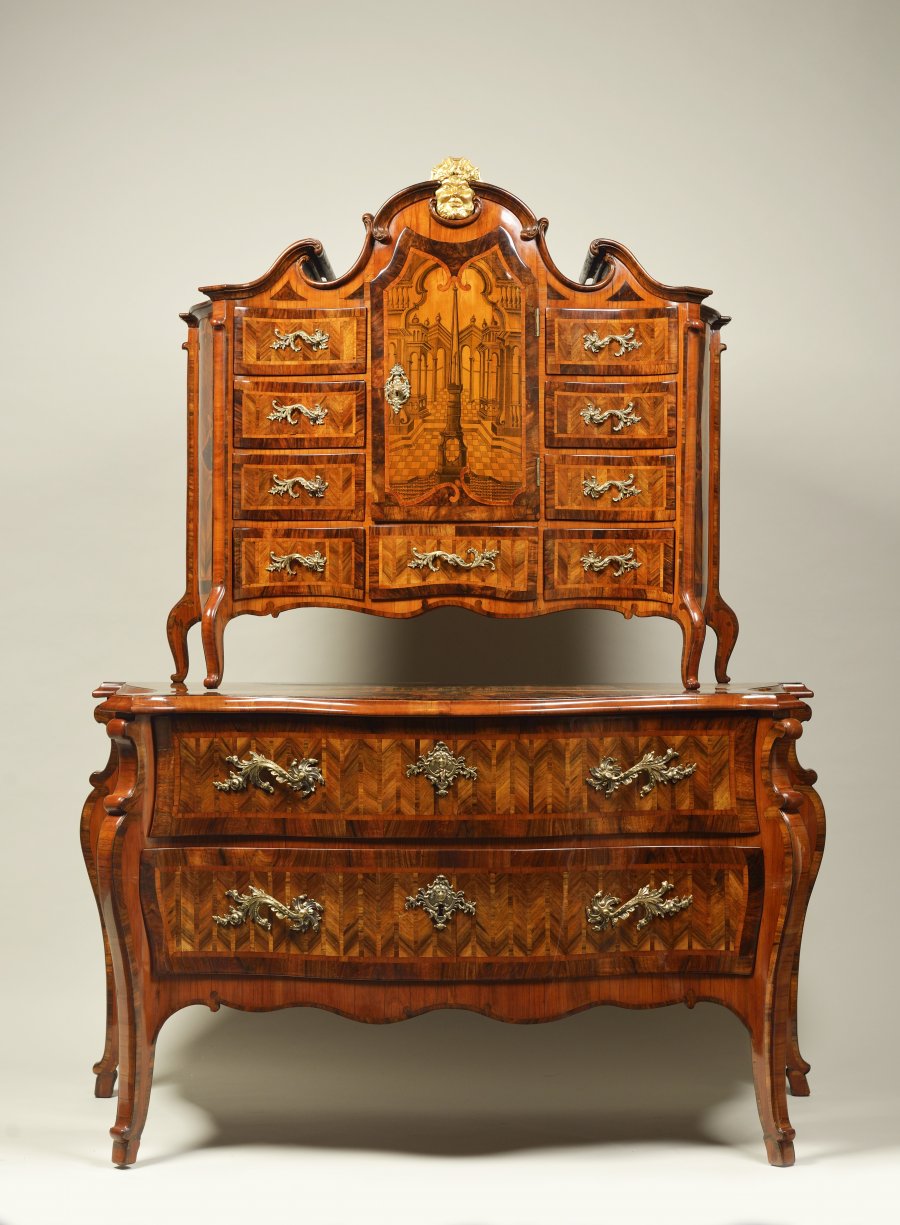 A BAROQUE COMMODE WITH TOP PIECE