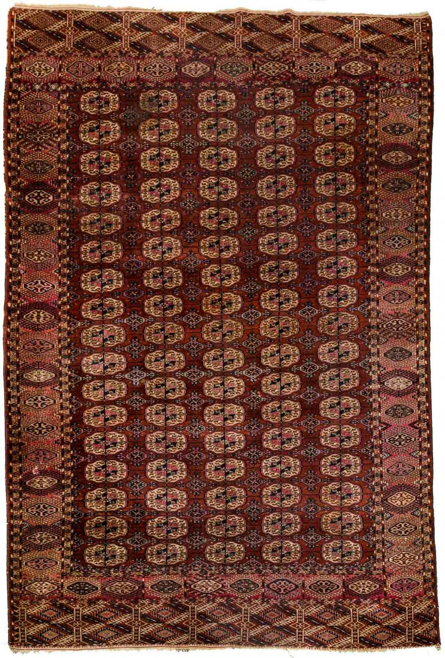 AN ANTIQUE RUG TEKKE